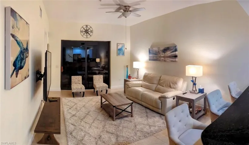 Tiled living room with ceiling fan