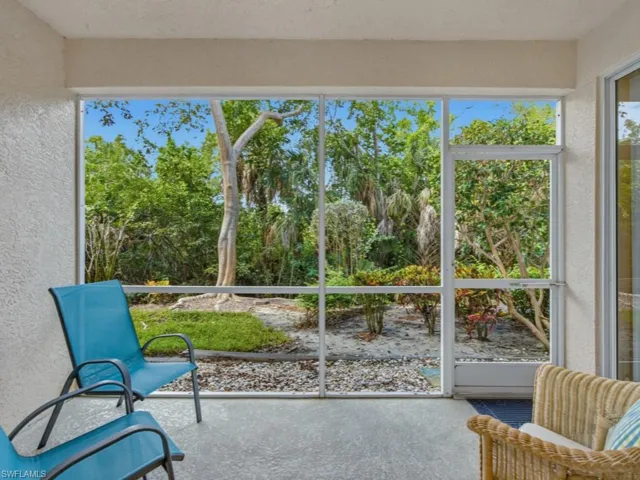 The ground-floor screened lanai features convenient exterior access, enhancing the home’s easy indoor-outdoor lifestyle.