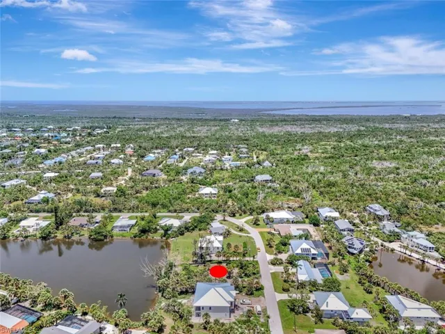 Aerial perspective of suburban area with a nearby body of water