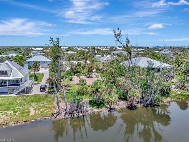 Aerial perspective of suburban area with a nearby body of water