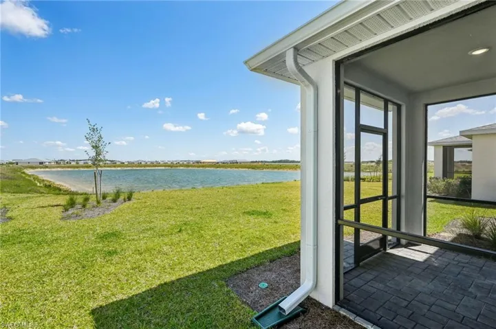 View of yard with a water view