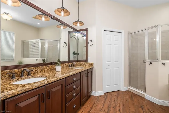 Master Bath with dual sinks, granite countertop, walk-in shower and soaking tub