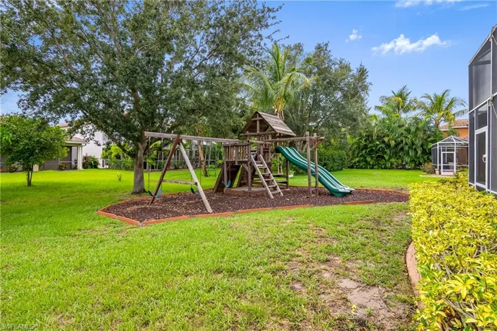 View of play area featuring a yard
