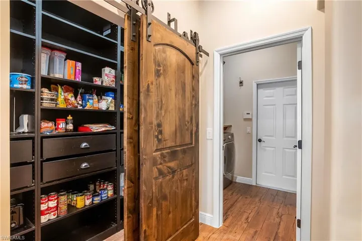 walk-in pantry with barn doors