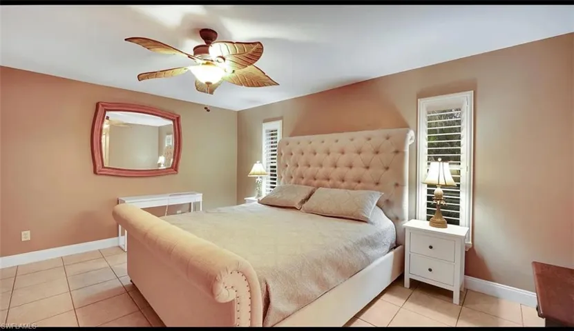 Tiled bedroom with ceiling fan