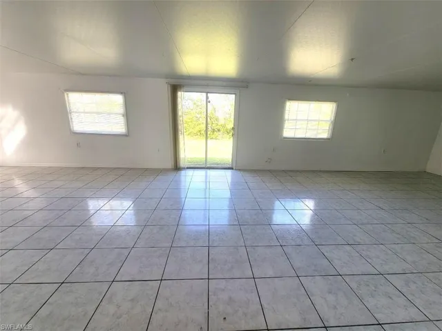 Huge Bonus Room that can be used as a Den - Facing Sliders to Yard - View #1