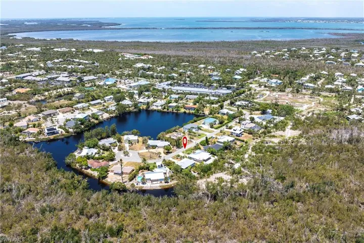 Aerial view featuring a water view and a residential view