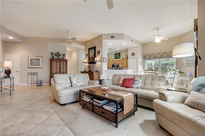 open living space w/tile flooring & 11’ Ceiling!