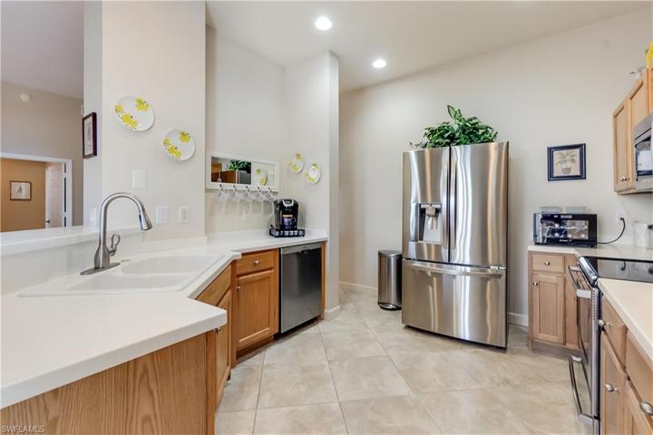 Neutral walk through Kitchen w/SS appliances
