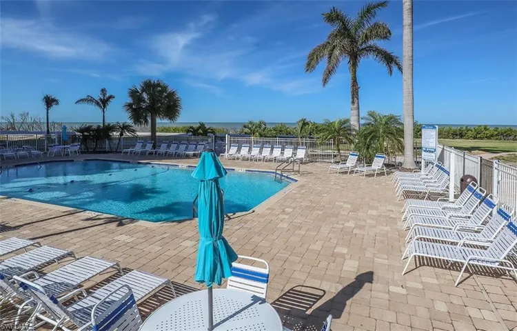 Community pool featuring a patio