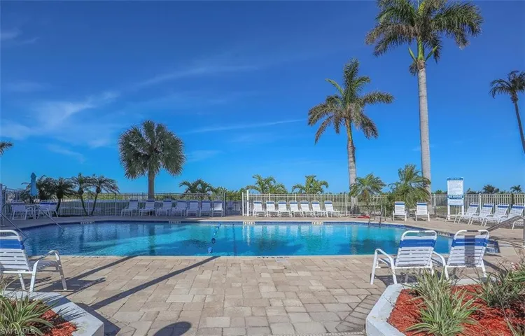 Community pool with a patio area