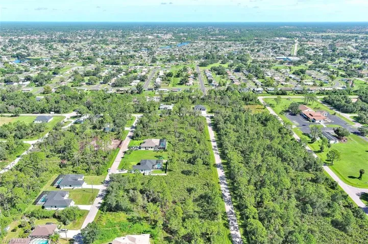 View of property location with nearby suburban area