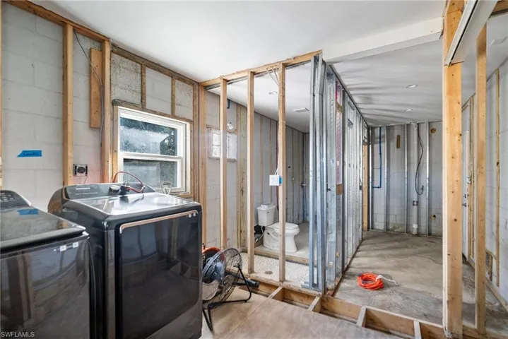 Laundry room featuring separate washer and dryer