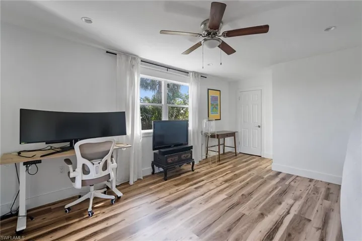 Office featuring light hardwood / wood-style flooring and ceiling fan