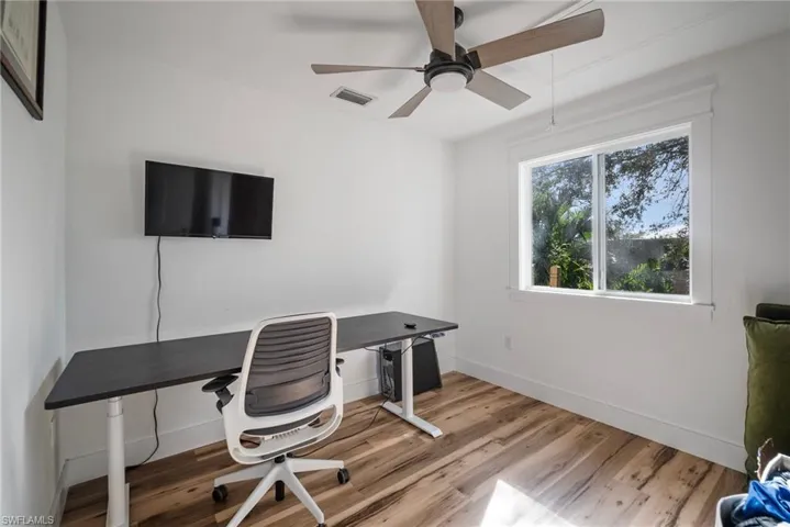 Office area featuring ceiling fan and hardwood / wood-style flooring