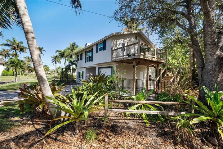 Rear view of property with a wooden deck
