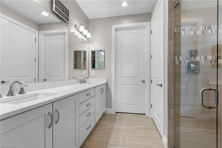 Bathroom with vanity and an enclosed shower
