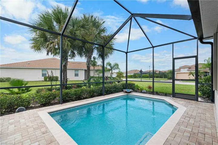 View of pool featuring a lanai and a patio
