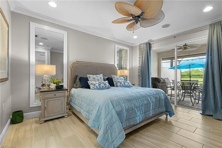 Bedroom featuring ornamental molding, ceiling fan, and access to exterior