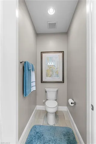 Bathroom featuring tile patterned flooring and toilet
