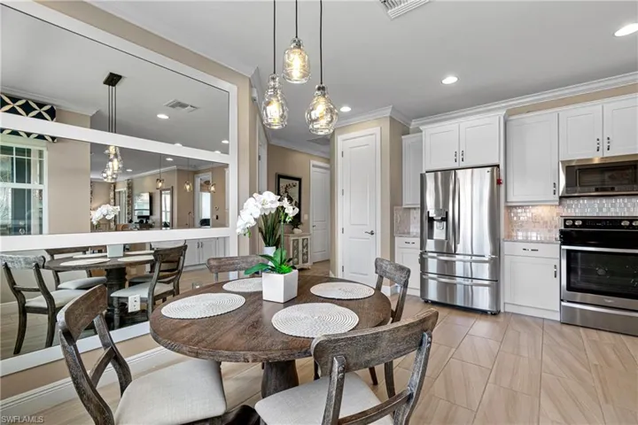 Dining area featuring crown molding