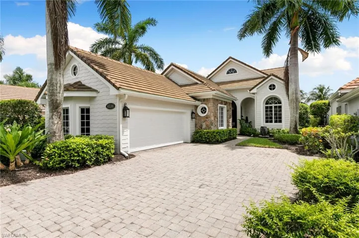 View of front facade featuring a garage