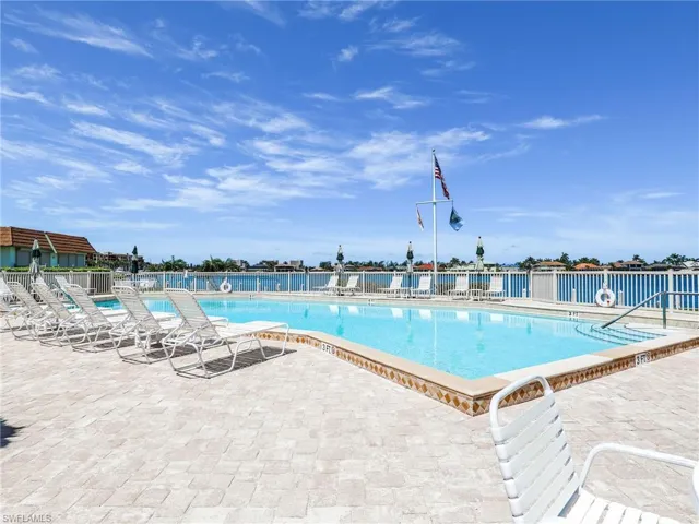 Community pool featuring a patio