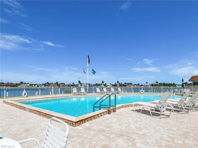 Community pool featuring a patio