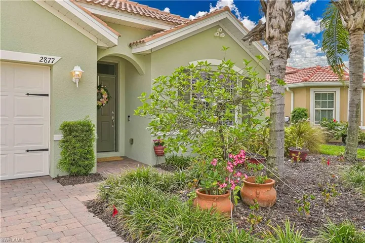 Stucco exterior with a terracotta tile roof