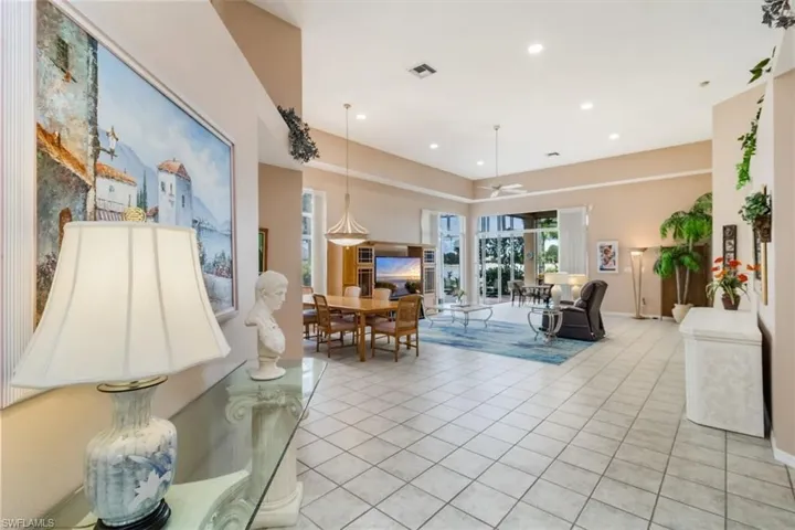 Living room featuring light tile floors