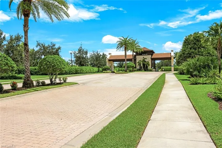 Grand entrance with palm-lined streets.