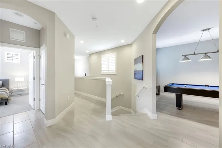 Versatile loft-style space currently being used as a game room.