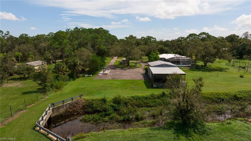 There is a long driveway and ample outdoor parking also