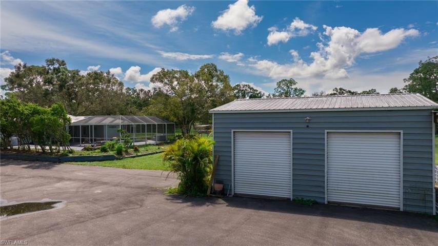 A HUGE garage for anything you have in mind (30' x 23') w/2 ceiling fans to help keep it cool. Also fits 4 cars