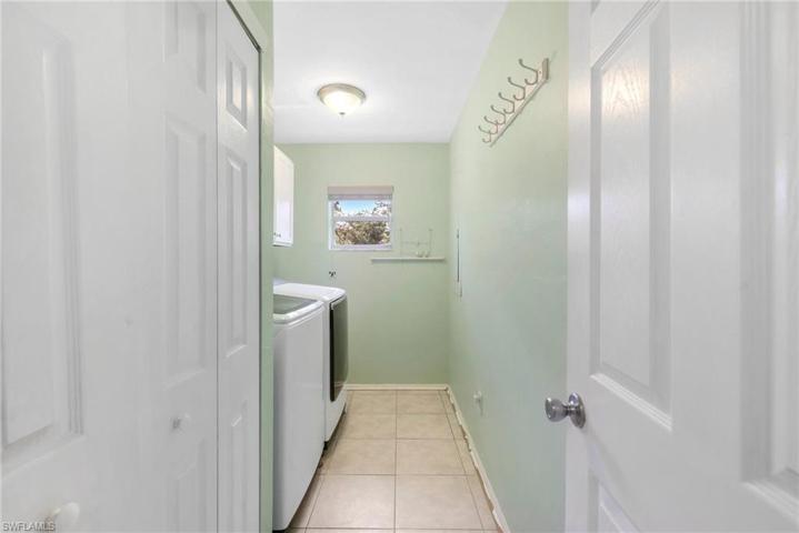 The 11' x 5' laundry room with cabinets & a utility closet.