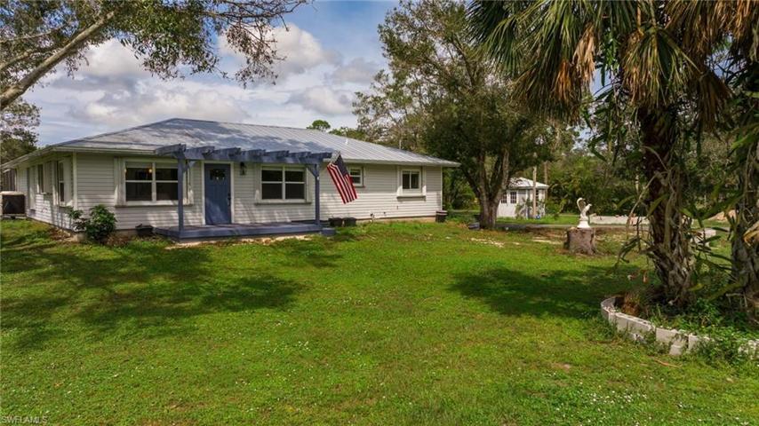 Welcome home to this 5+ acre country estate in N. Fort Myers. Zoned AG2