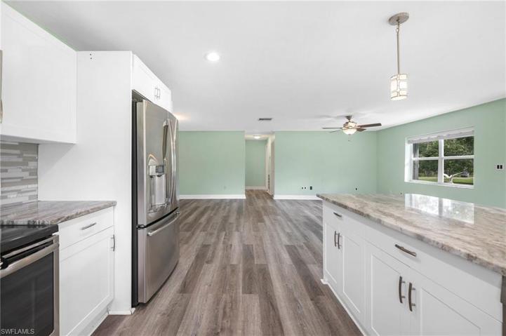Warm grey wood plank laminate flooring throughout the home (new in 2022)