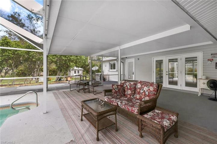 The under cover screened patio area with space for an outdoor dining area