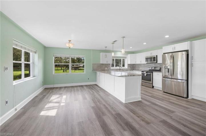 This is just half of the 29' long living/family room & the gorgeous kitchen