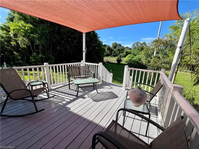 Wooden deck featuring a yard