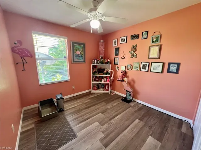 Guest bedroom with luxury vinyl plank flooring.