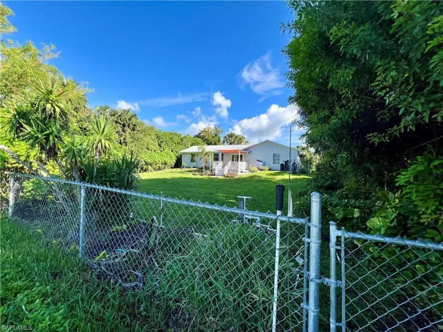 View of fenced yard from the canal.
