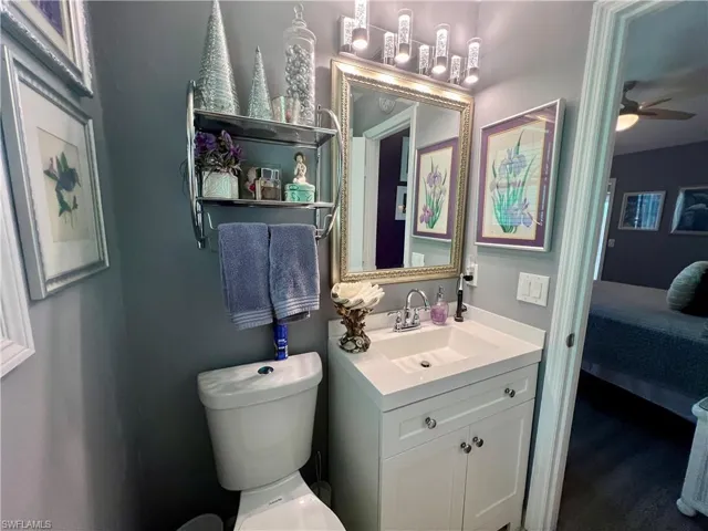 Bathroom featuring oversized vanity, toilet