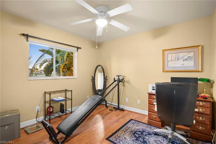 Home office featuring light wood-type flooring and ceiling fan