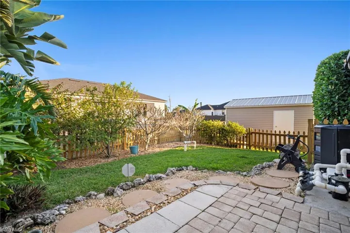 Fenced backyard featuring a patio