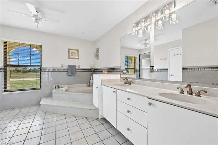 Primary bath has separate tub and shower
