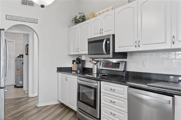 Kitchen features tiled backsplash