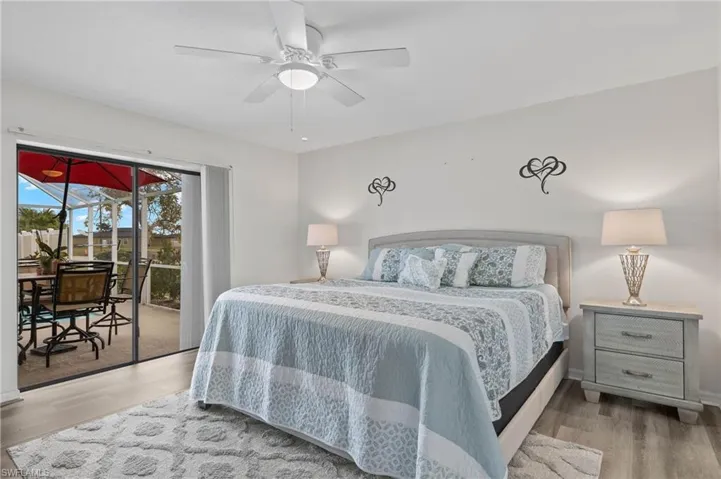 Large primary bedroom walks out to pool via slider