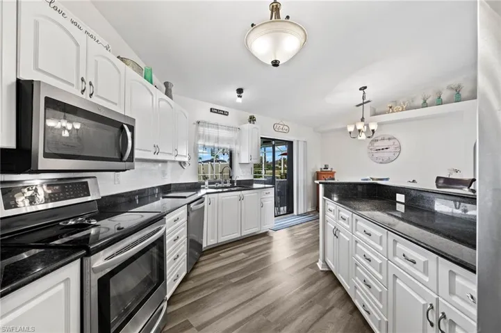 Beautiful kitchen with granite counter tops and stainless steel appliances
