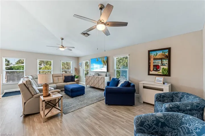 Living room from hallway front windows give a view of the Gulf